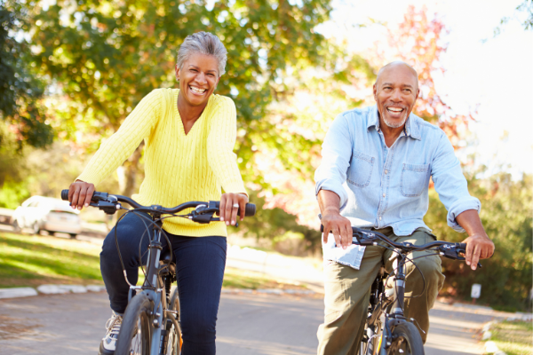 elderly couple riding bikes